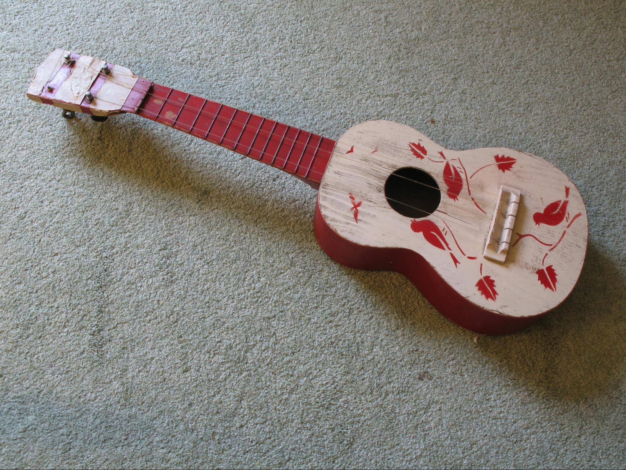 large string instrument played with fingers